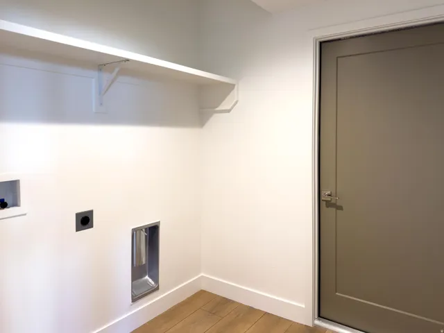 Laundry room featuring light wood-style flooring, washer hookup, and electric dryer hookup