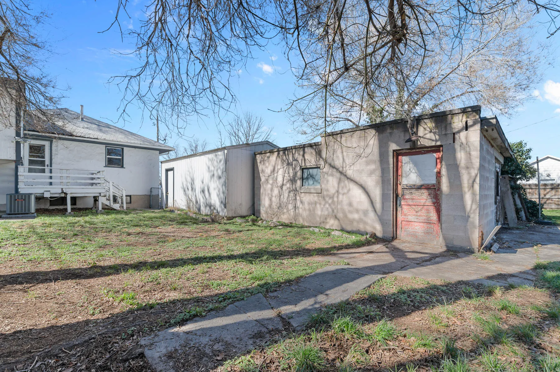 back of home, deck, garage, and workshop