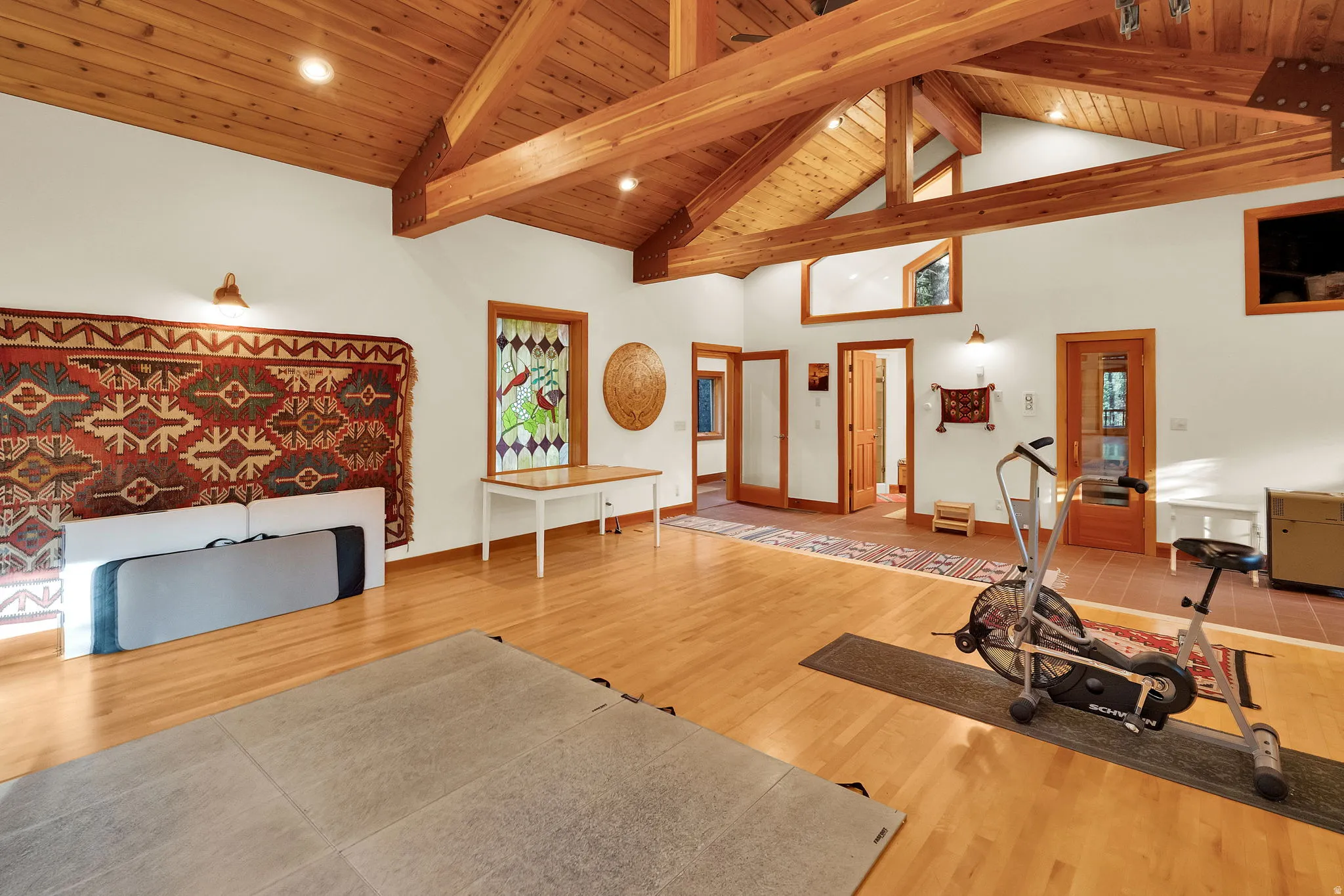 Vaulted wood-paneled ceiling with exposed beams