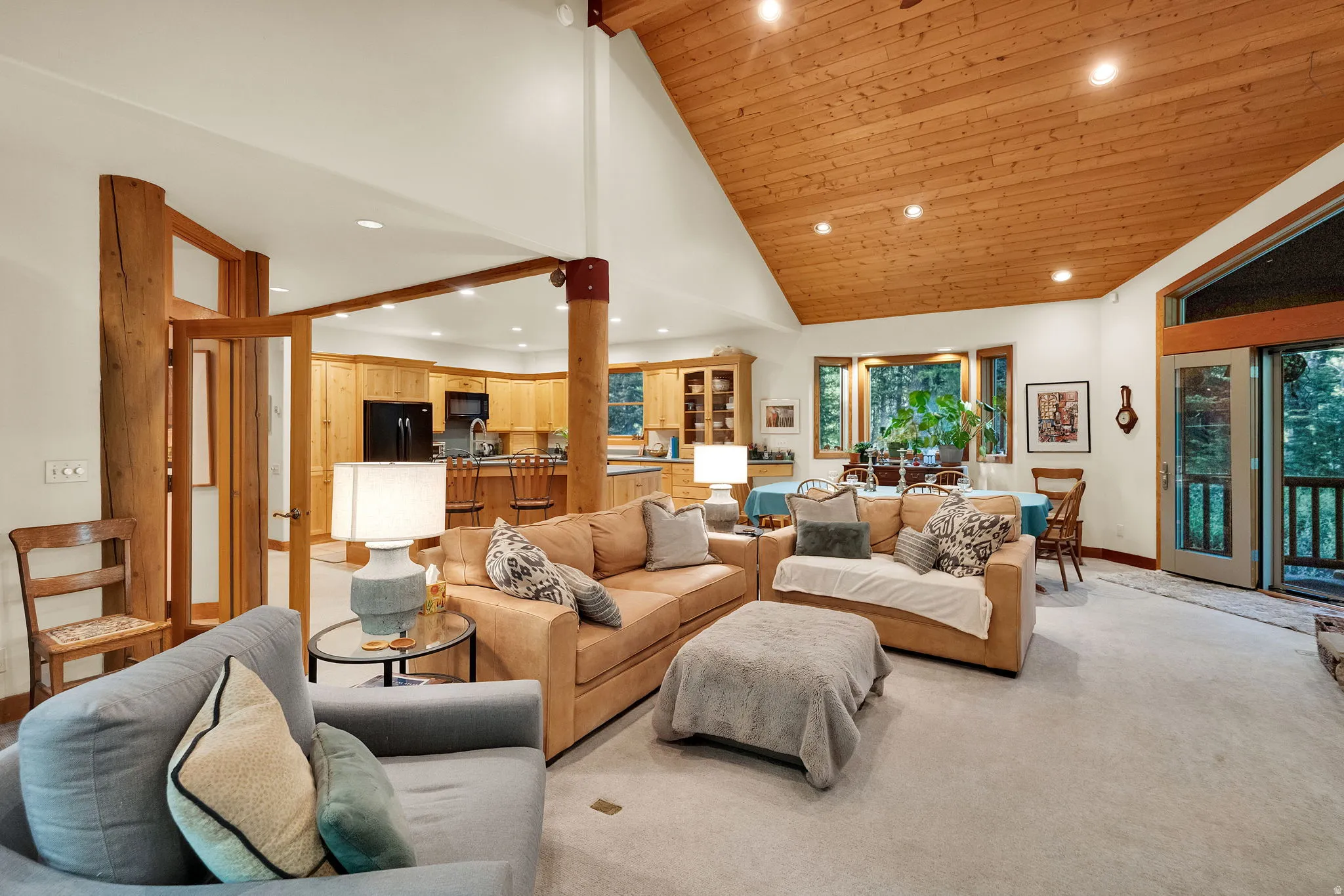 Vaulted wood-paneled ceiling with recessed lighting