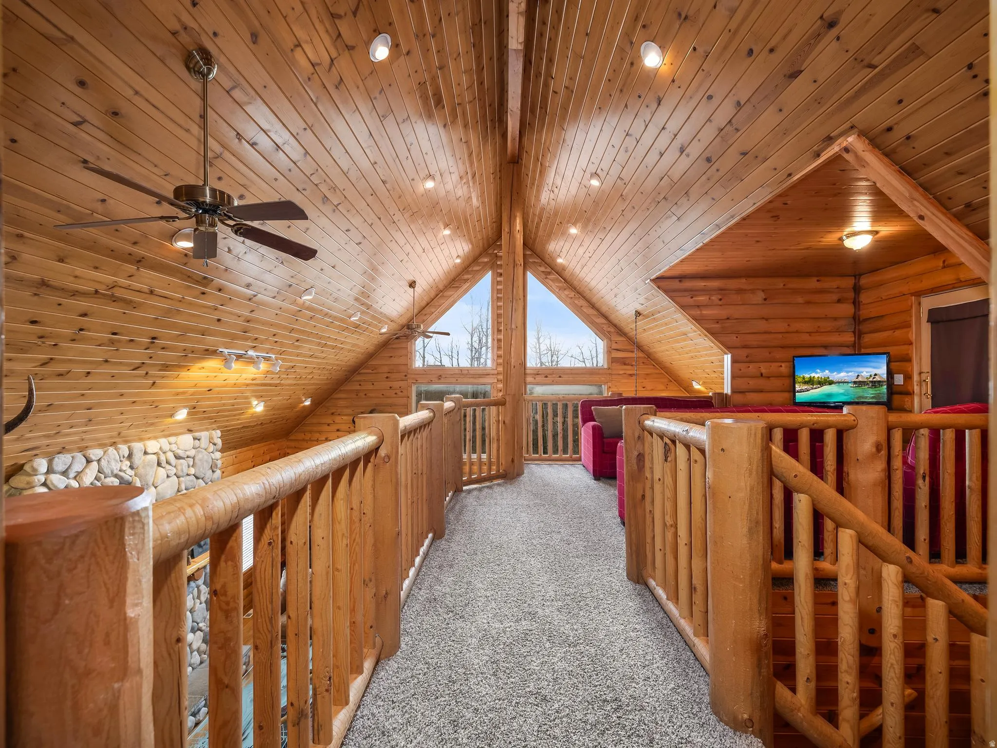 Corridor featuring carpet, rustic walls, a wood ceiling with exposed beams, an upstairs landing, and recessed lighting