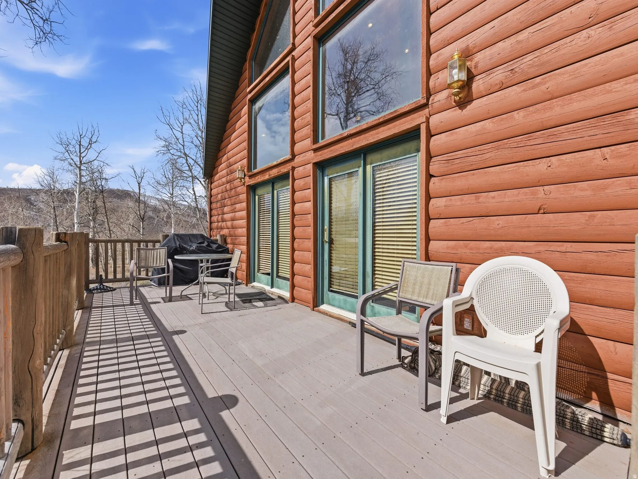 Wooden terrace featuring grilling area