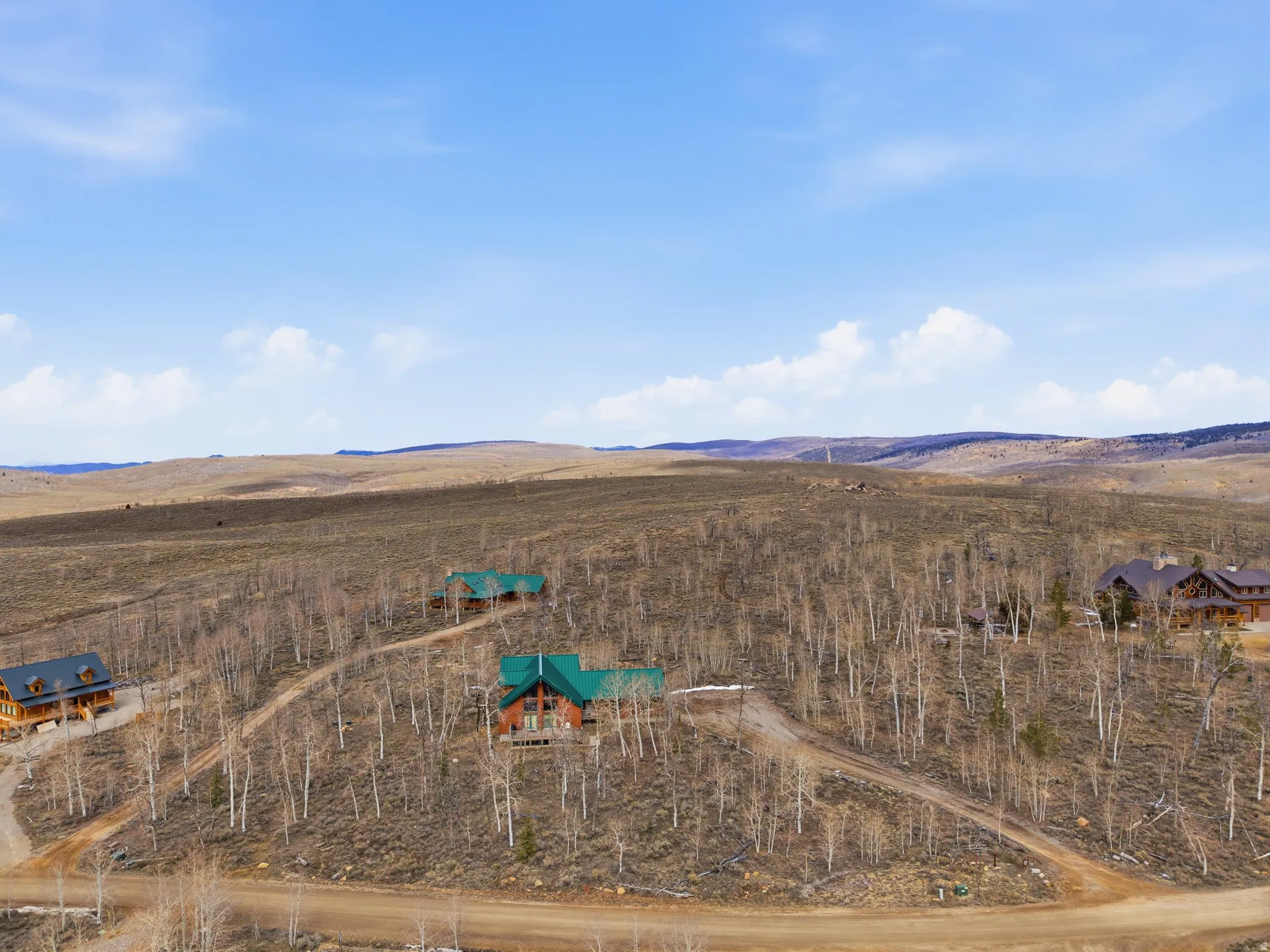 Overview of rural landscape featuring a mountain backdrop