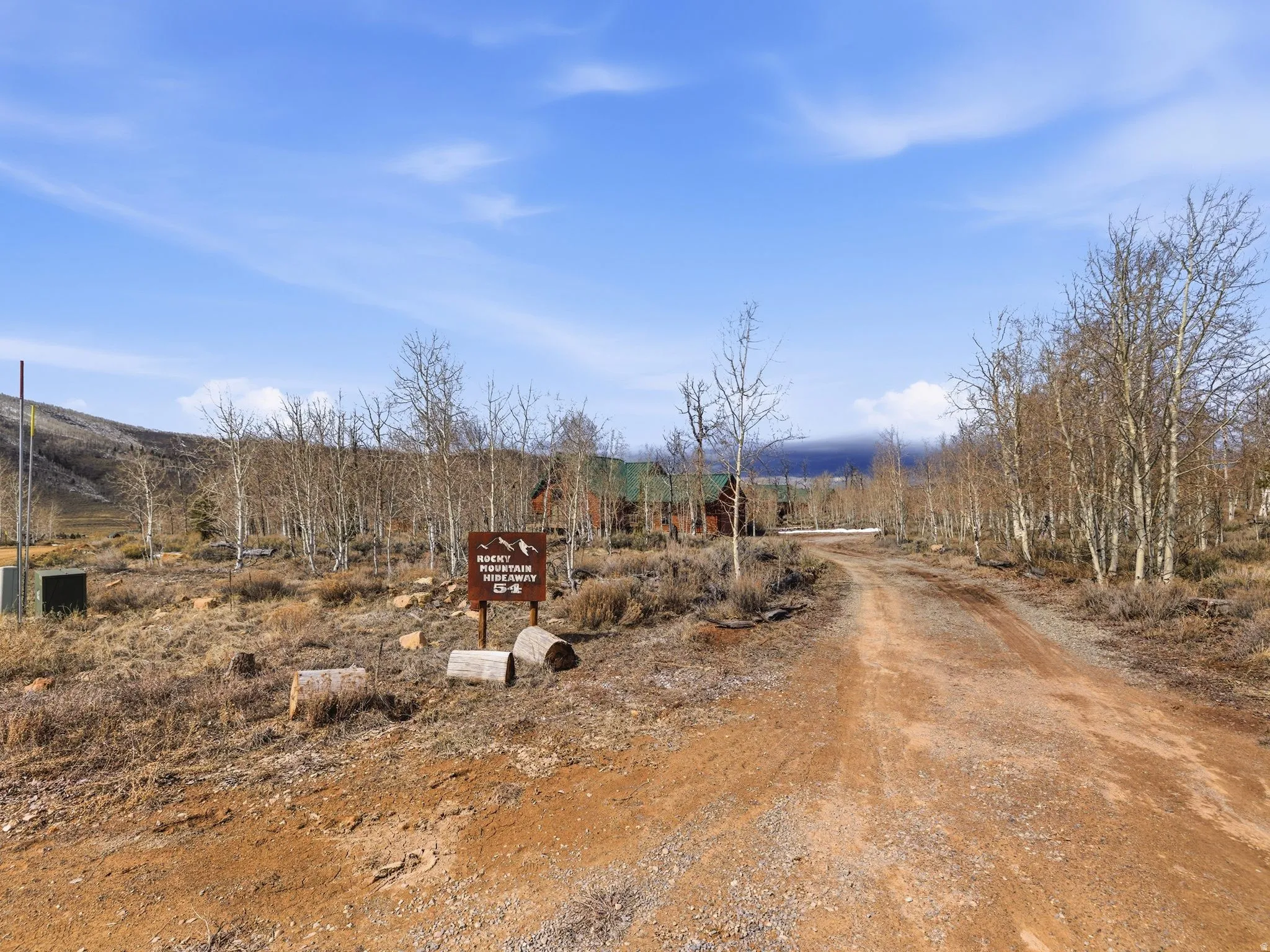 View of dirt / gravel road with a view of rural / pastoral area