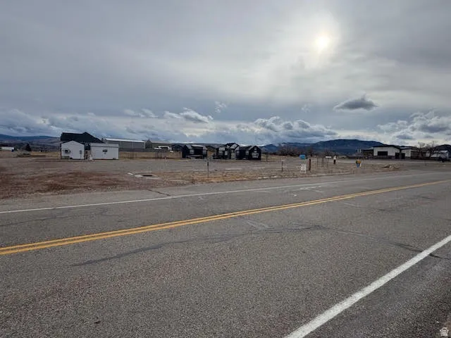 View of asphalt road featuring a mountain view