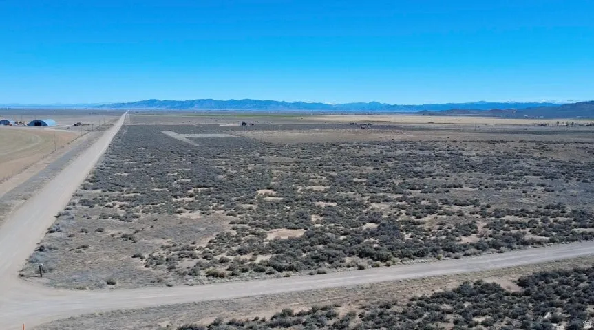 Aerial view of sparsely populated area featuring a desert landscape and mountains