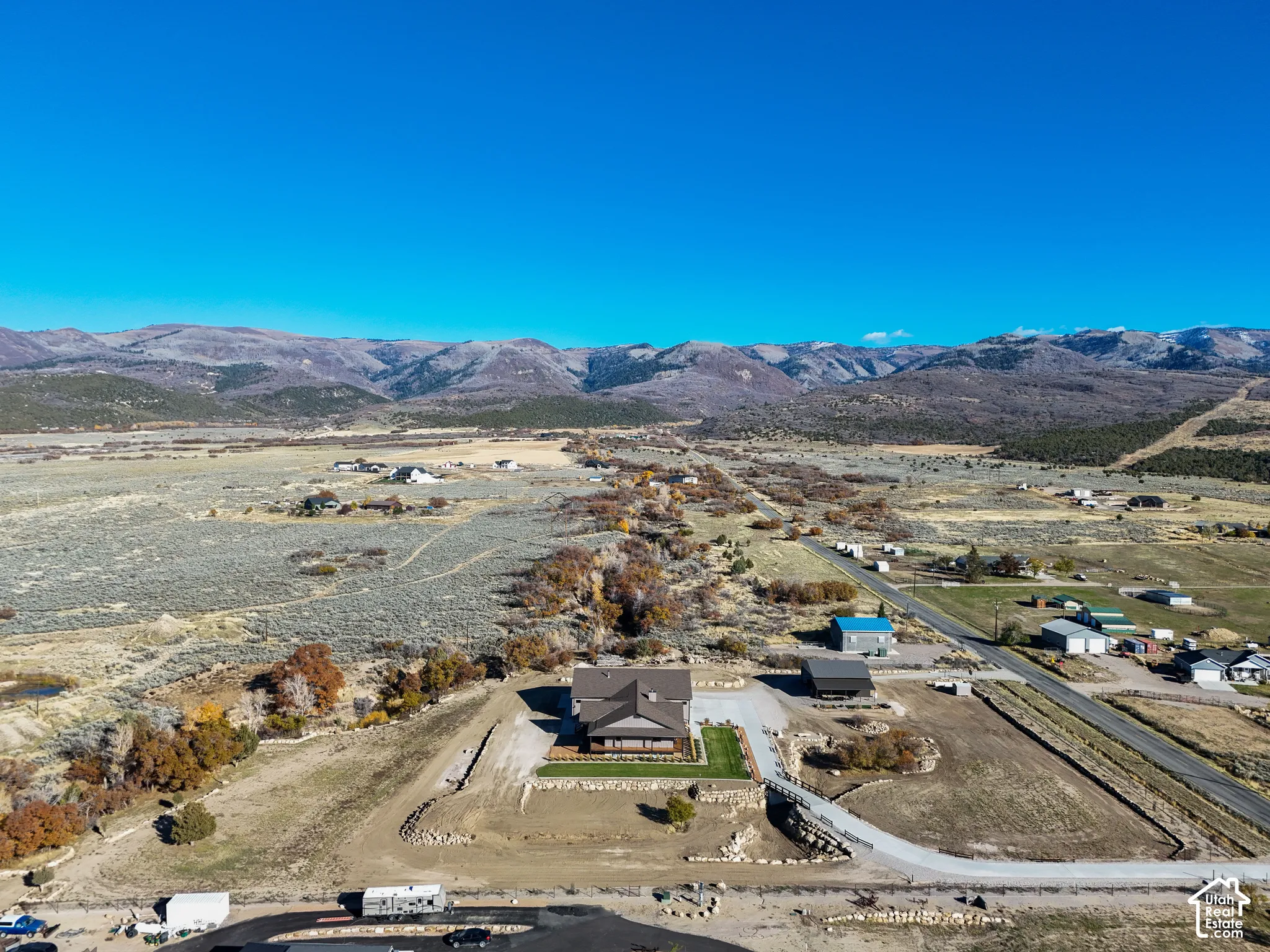Overview of rural landscape featuring a mountainous background