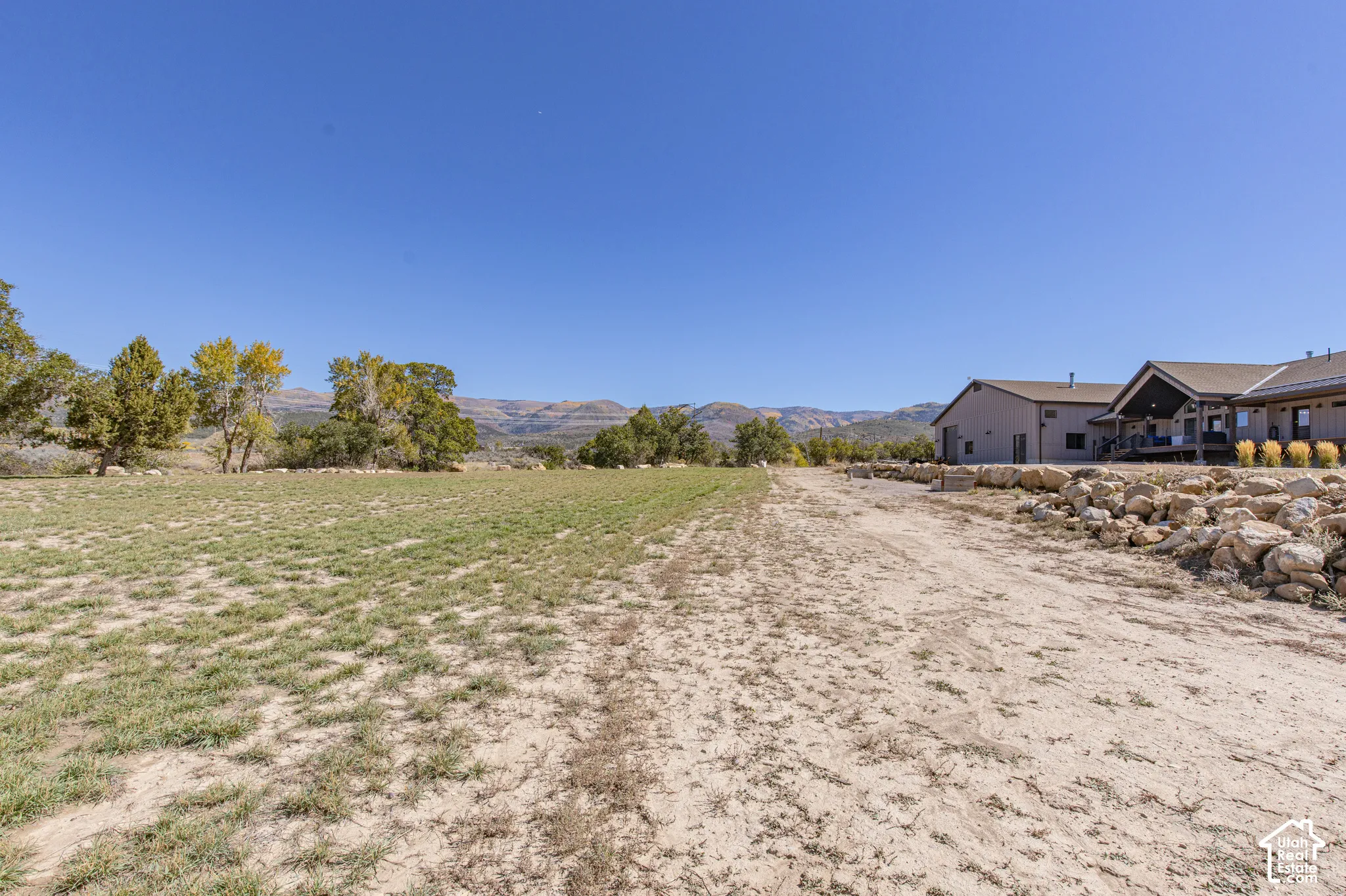 Expansive open land area with distant mountainous terrain