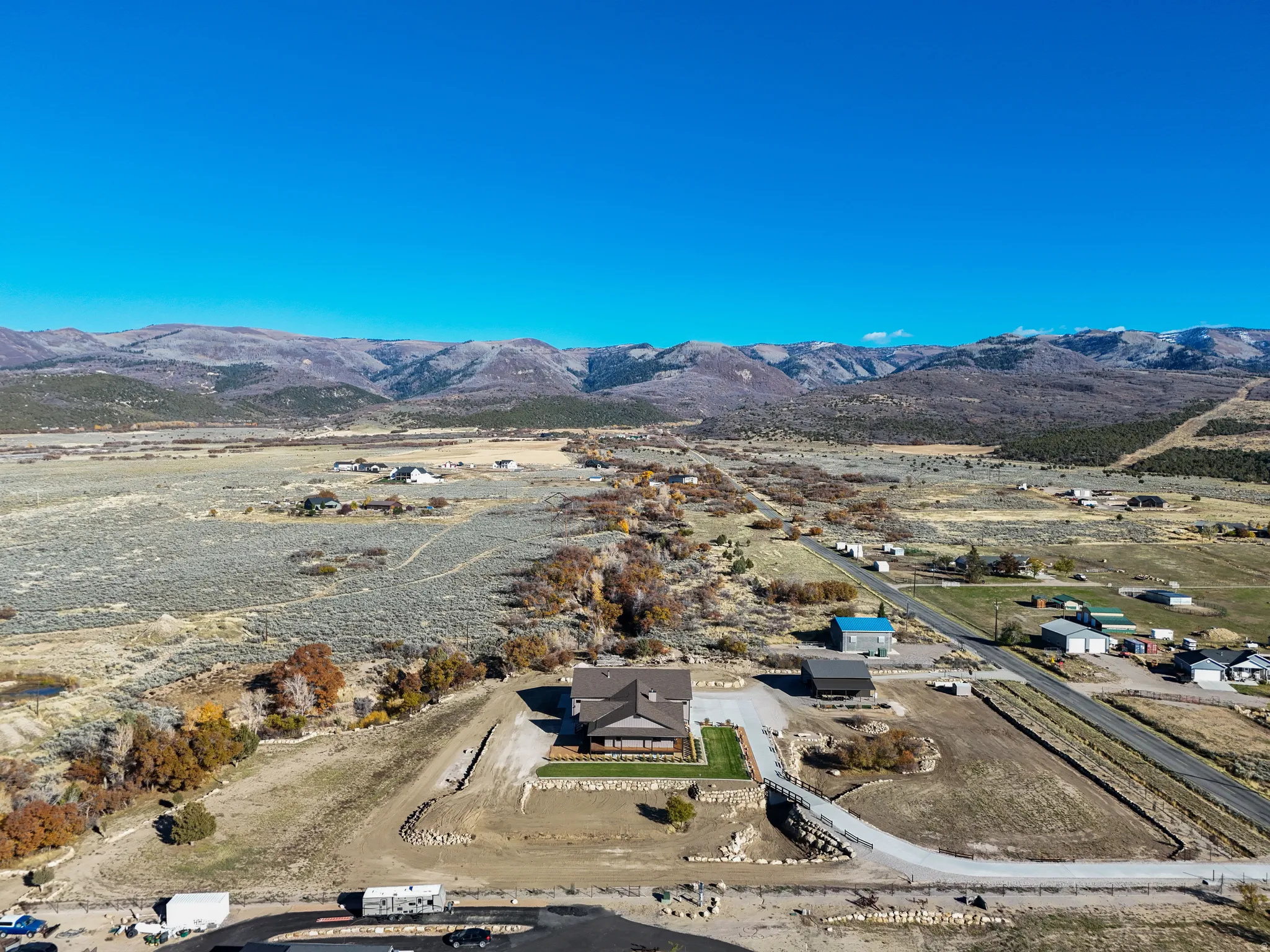 Overview of rural landscape featuring a mountainous background