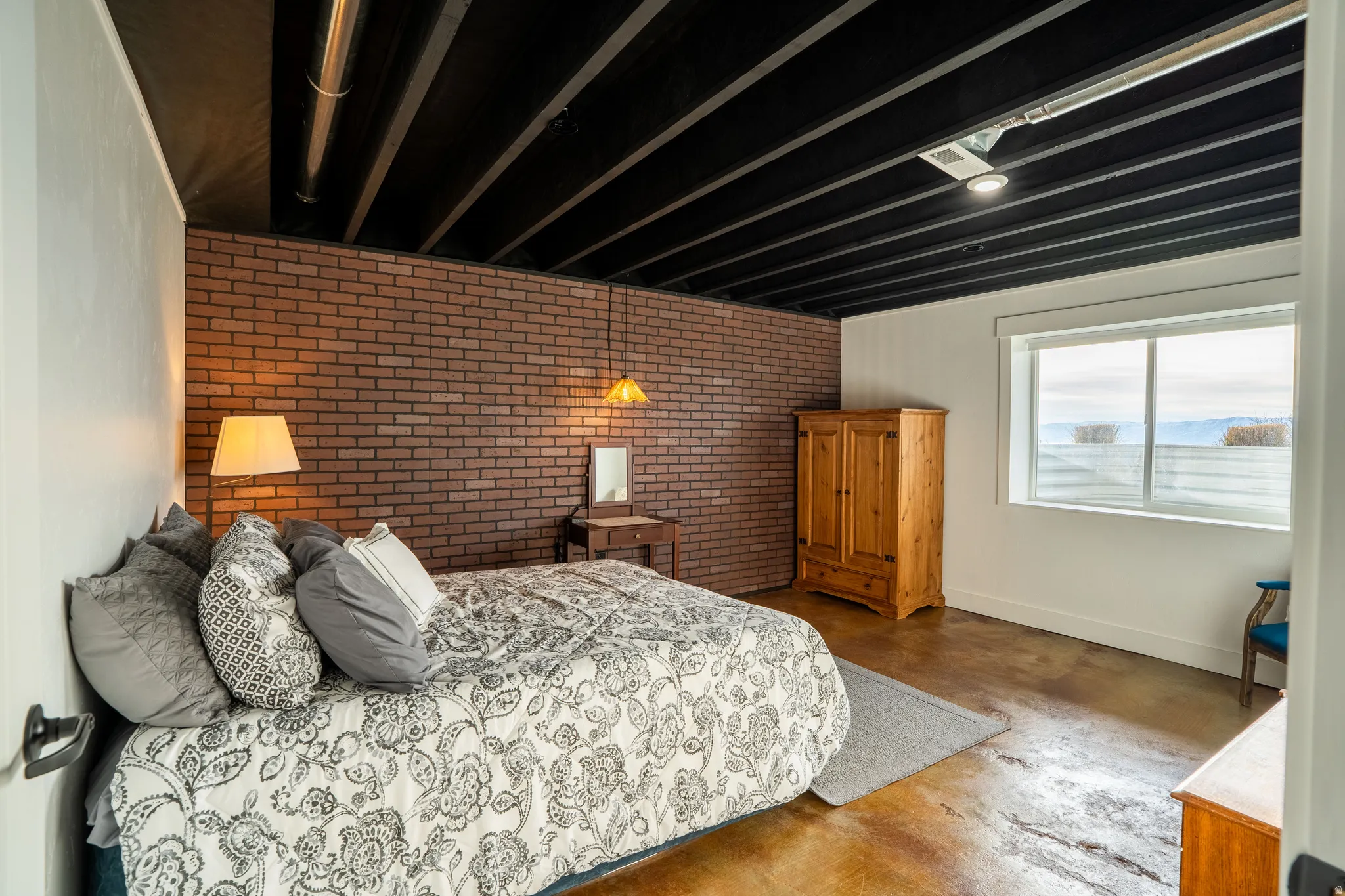 Bedroom 3 with almost ground level window for lots of natural light
