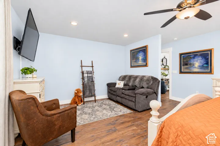 Recessed lighting, wood-finish flooring, and ceiling fan