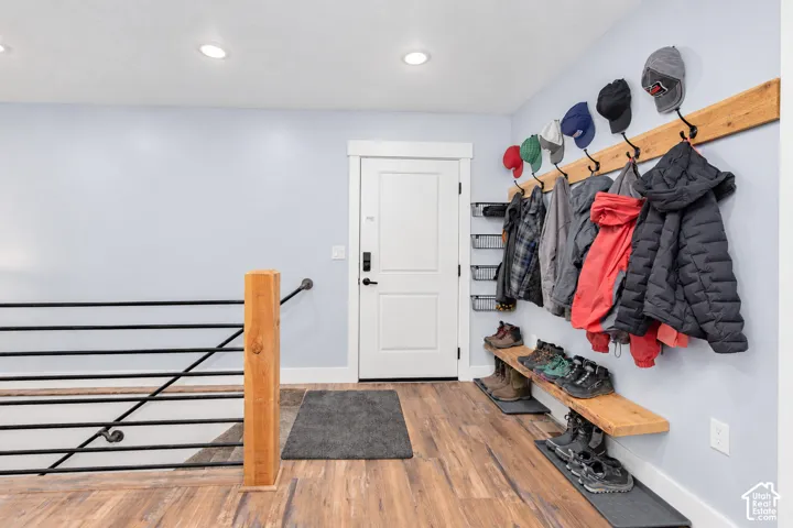 Wood-finish flooring with a modern wood-and-metal railing system