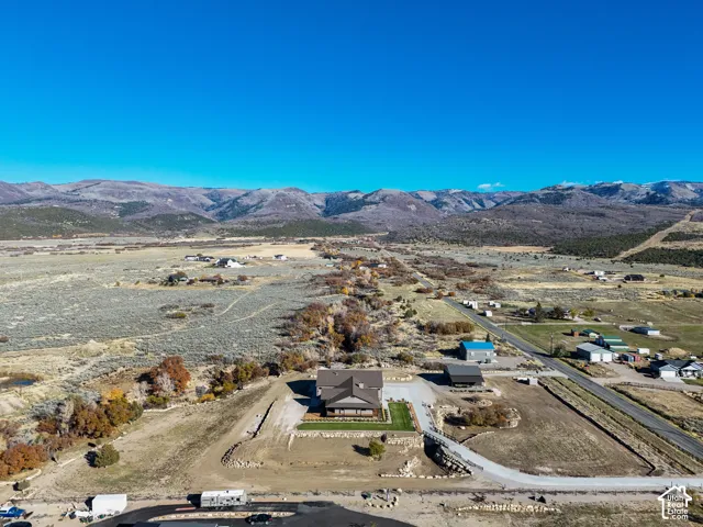 Overview of rural landscape featuring a mountainous background