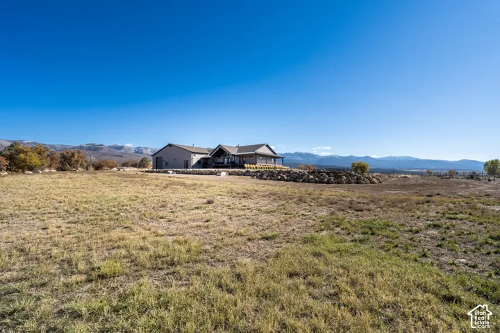 View of backyard near stream looking toward house
