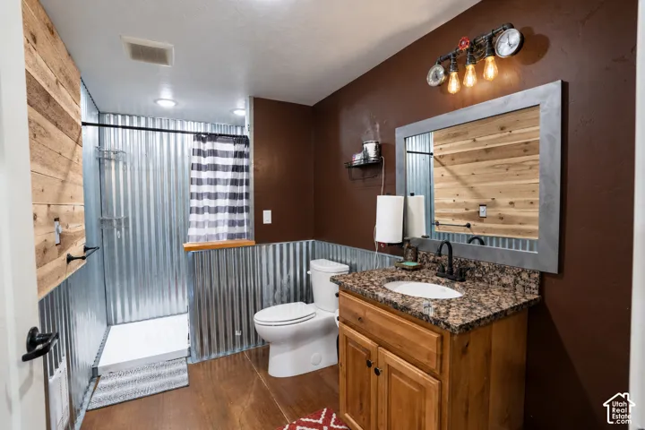 Wood-finish flooring with a textured shower floor