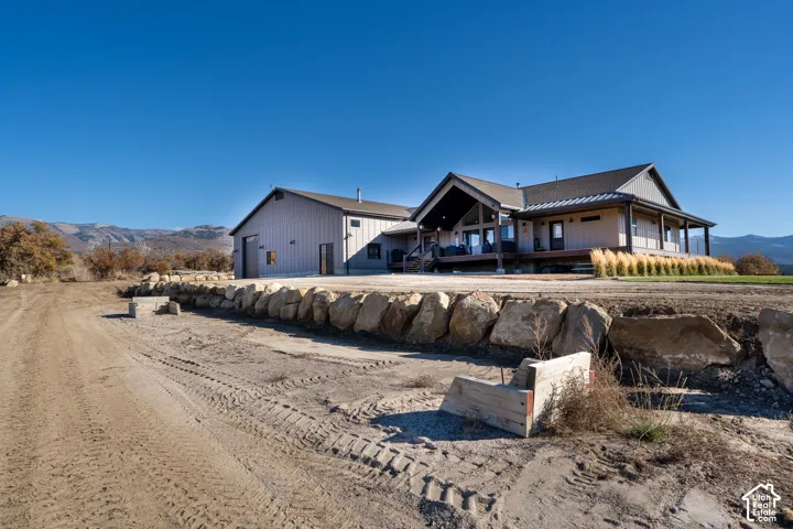 Back of house featuring wild land fire-rated exterior