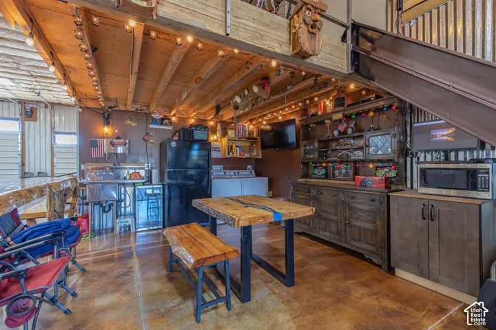 Exposed wood beam ceiling with string lighting