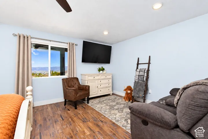 Wood-finish flooring, recessed lighting, and a ceiling fan