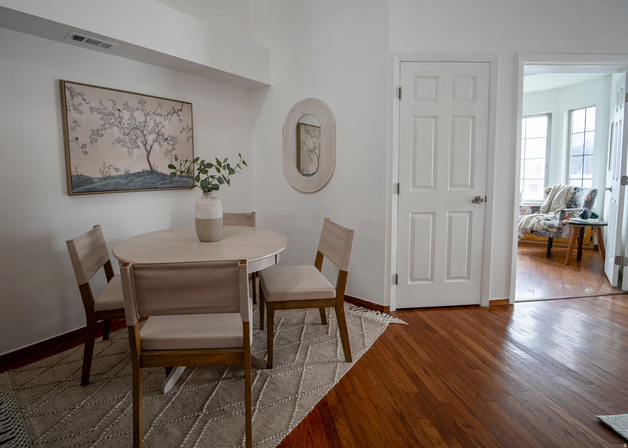 Dining area with light wood-type flooring and baseboards