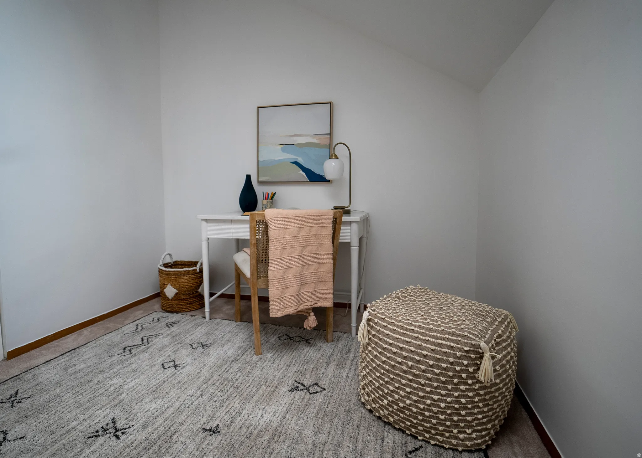 Office featuring vaulted ceiling and light colored carpet