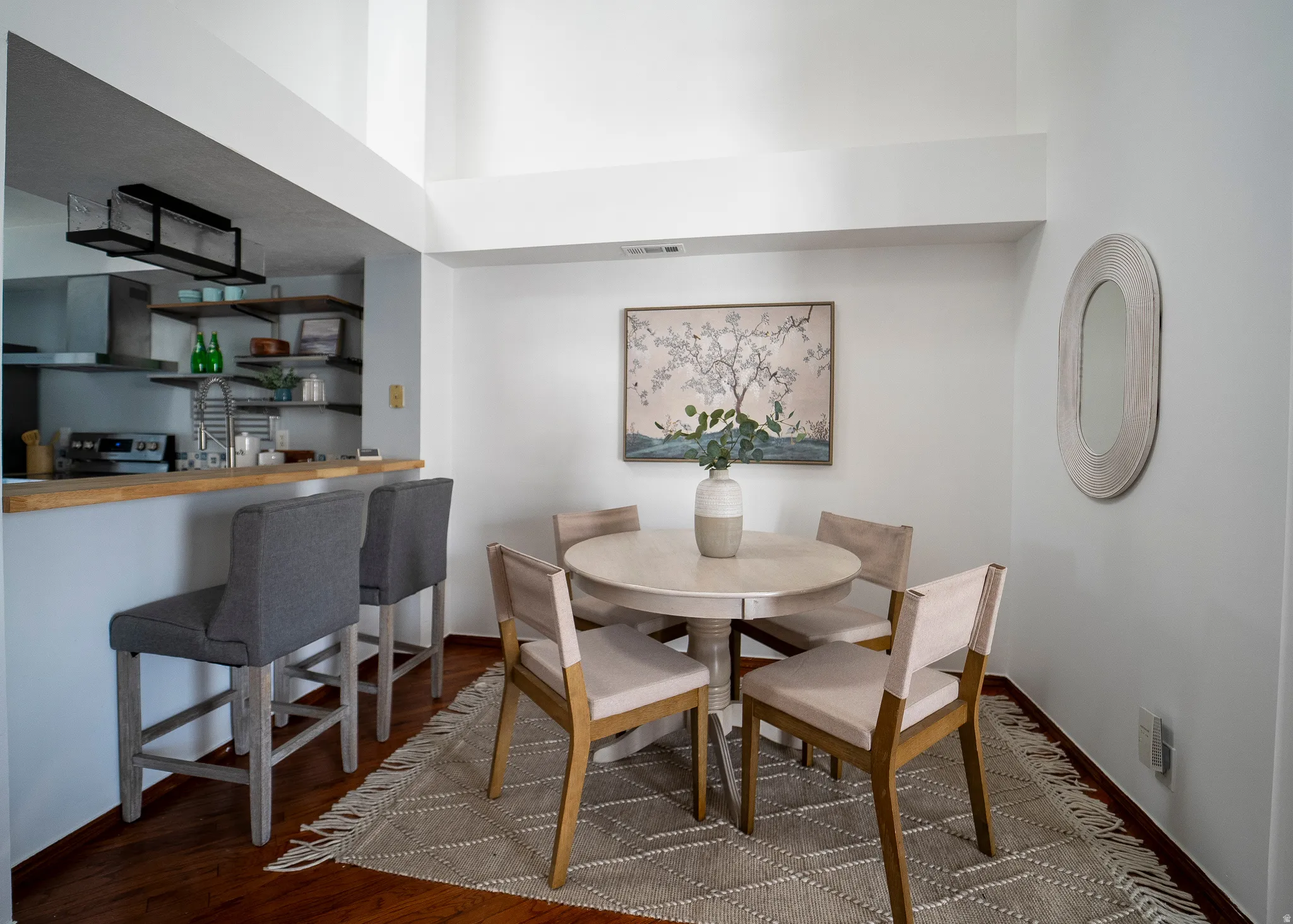 Dining area featuring dark wood-type flooring
