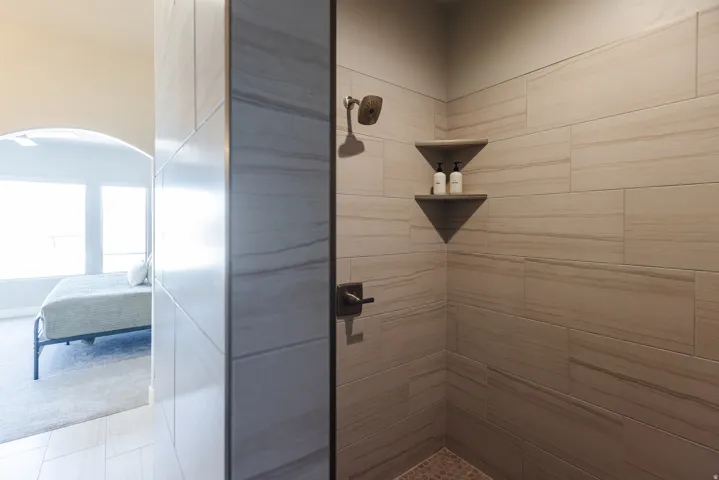 Ensuite bathroom featuring a shower stall