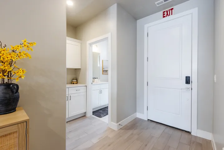 Foyer featuring light wood-style flooring and baseboards