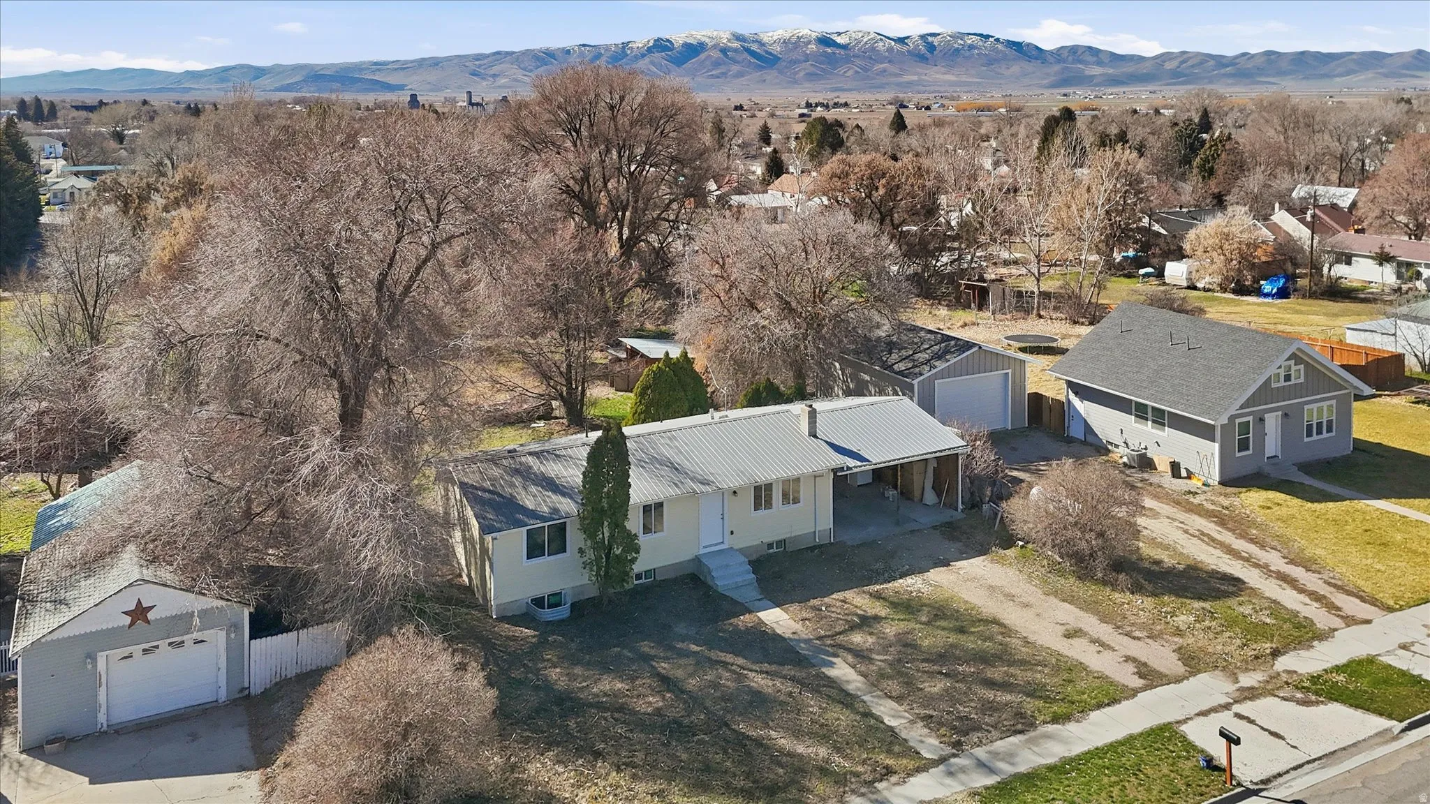 Aerial perspective of suburban area with a mountainous background