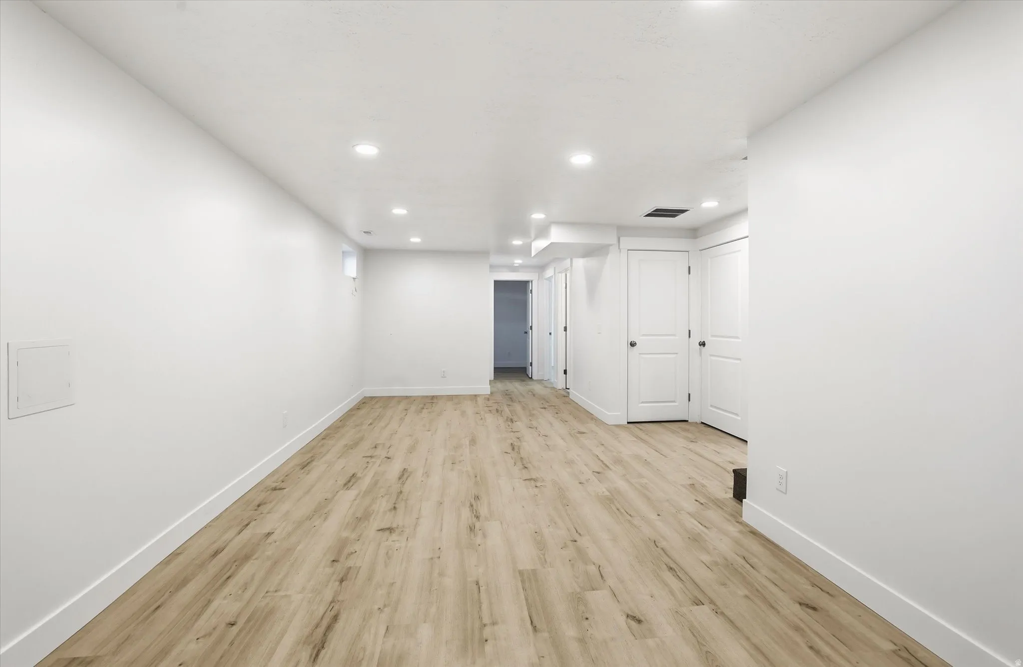 Unfurnished room featuring light wood-style flooring and recessed lighting