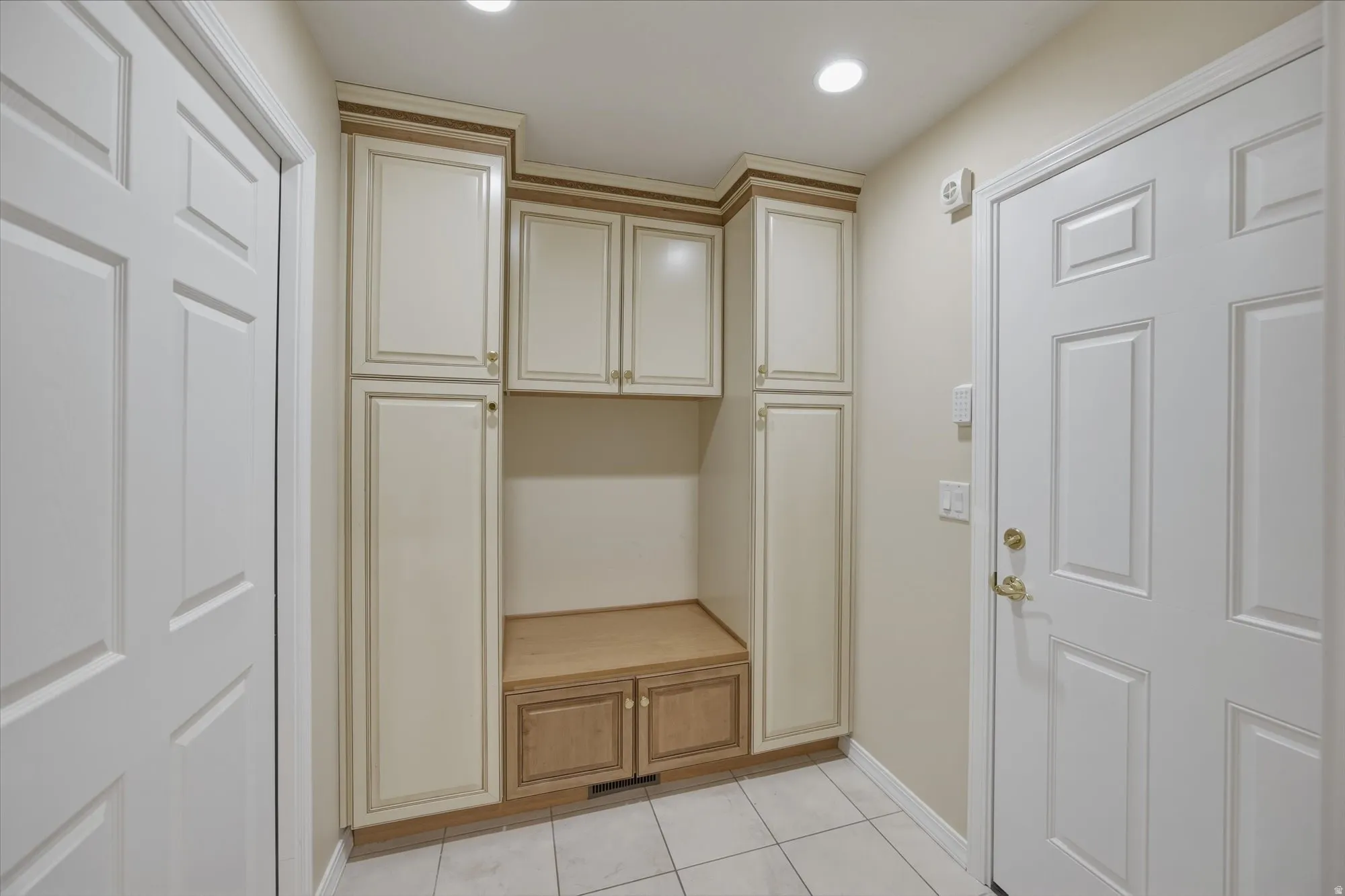 Mudroom featuring light tile patterned flooring and recessed lighting