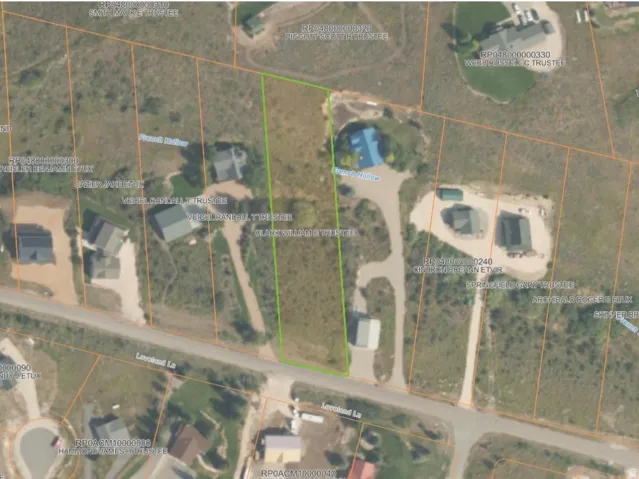 Aerial overview of property's location with property parcel outlined