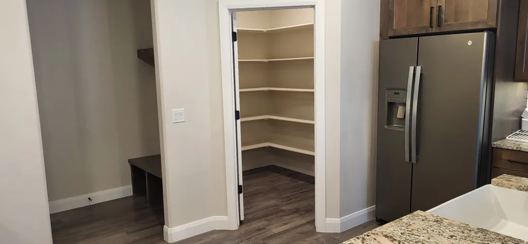 Walk-in pantry with extensive built-in shelving