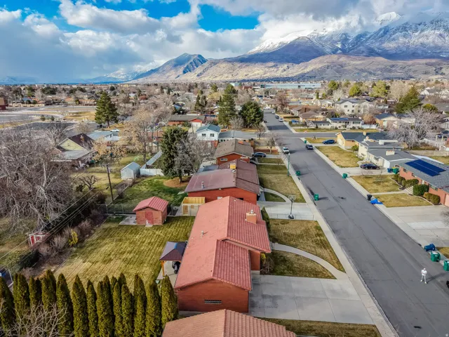 Aerial perspective of suburban area with a mountainous background