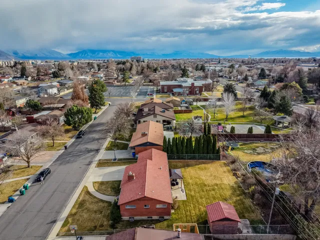 Aerial view of residential area with a mountain backdrop