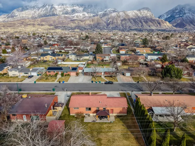 Aerial perspective of suburban area with a mountainous background