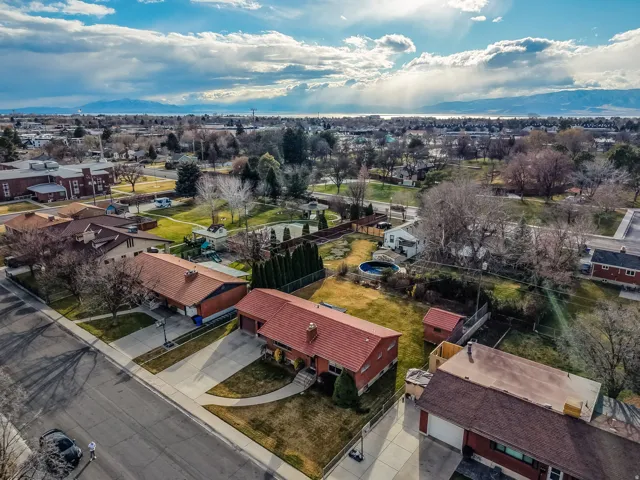 Aerial perspective of suburban area featuring a mountainous background