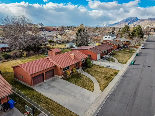 Aerial view of residential area with a mountainous background