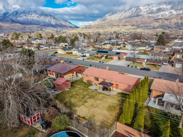 Aerial perspective of suburban area with a mountain backdrop