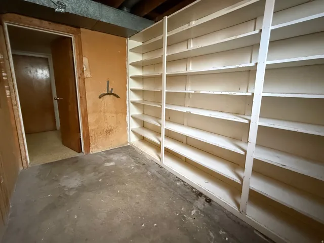 Extensive built-in shelving provides ample storage