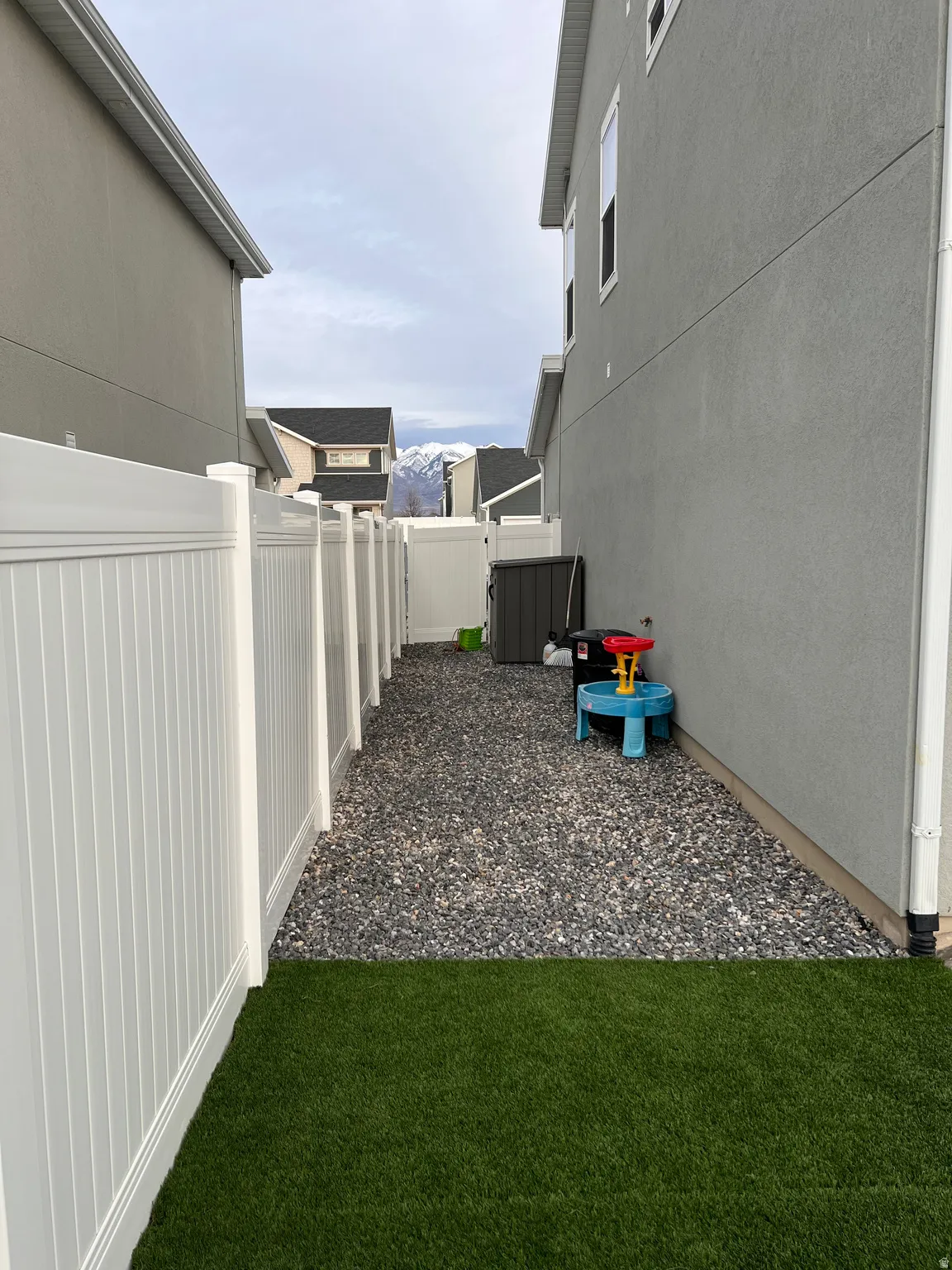 North side of yard featuring shed.