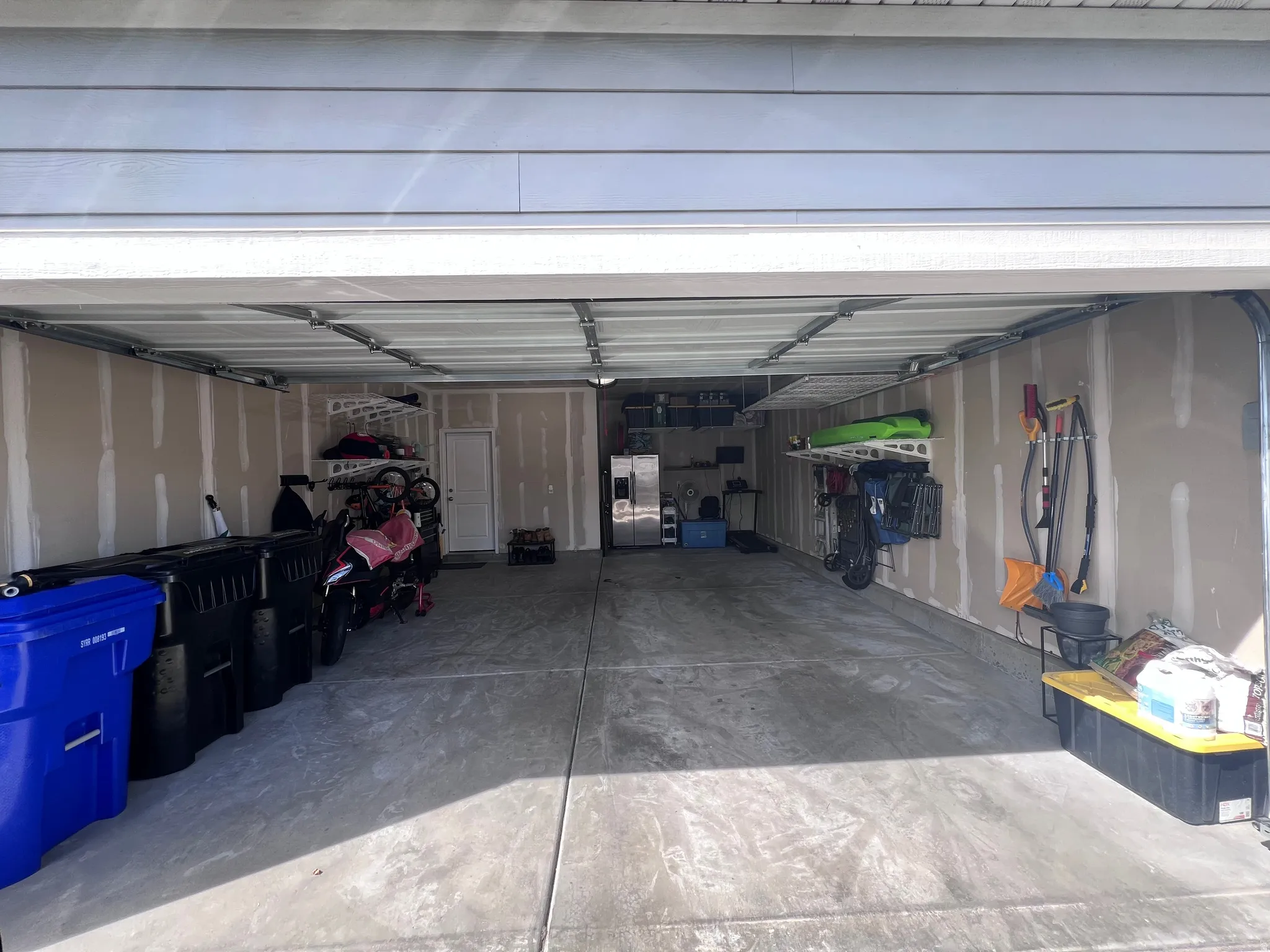 Garage with stainless steel fridge