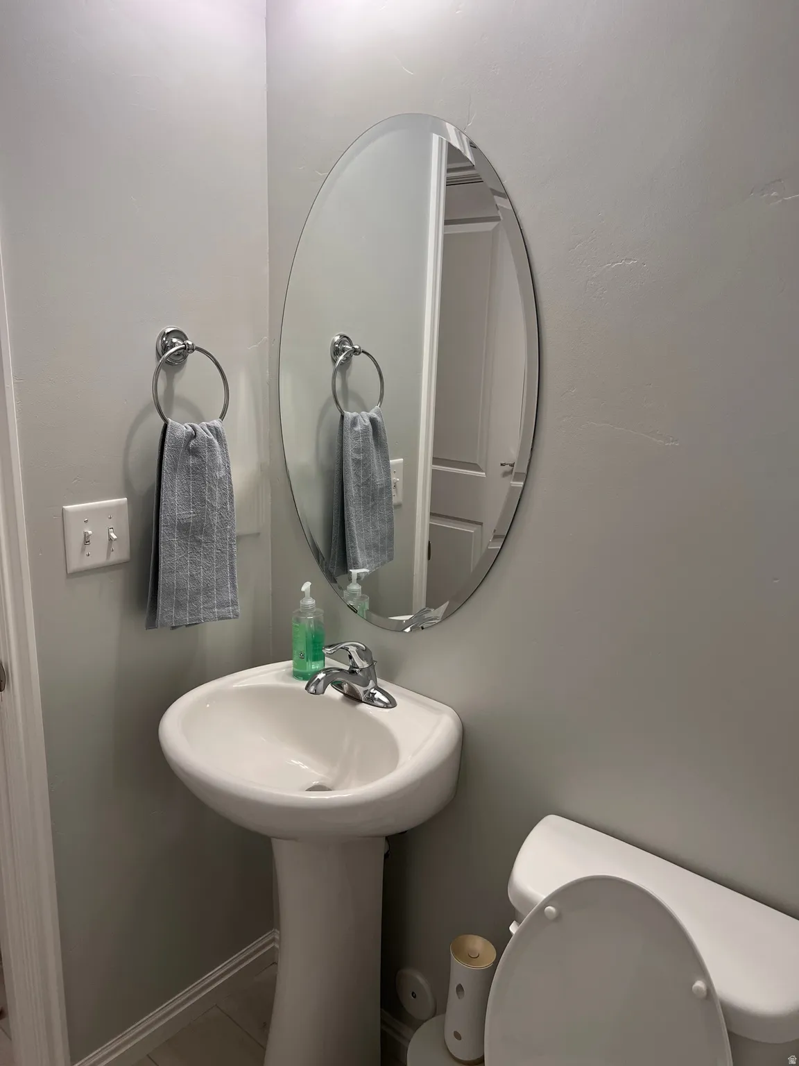 Bathroom with toilet and baseboards