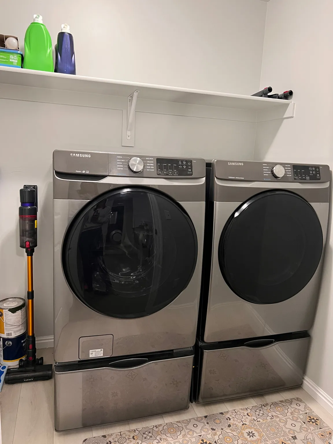 Laundry area with separate washer and dryer and pedestals