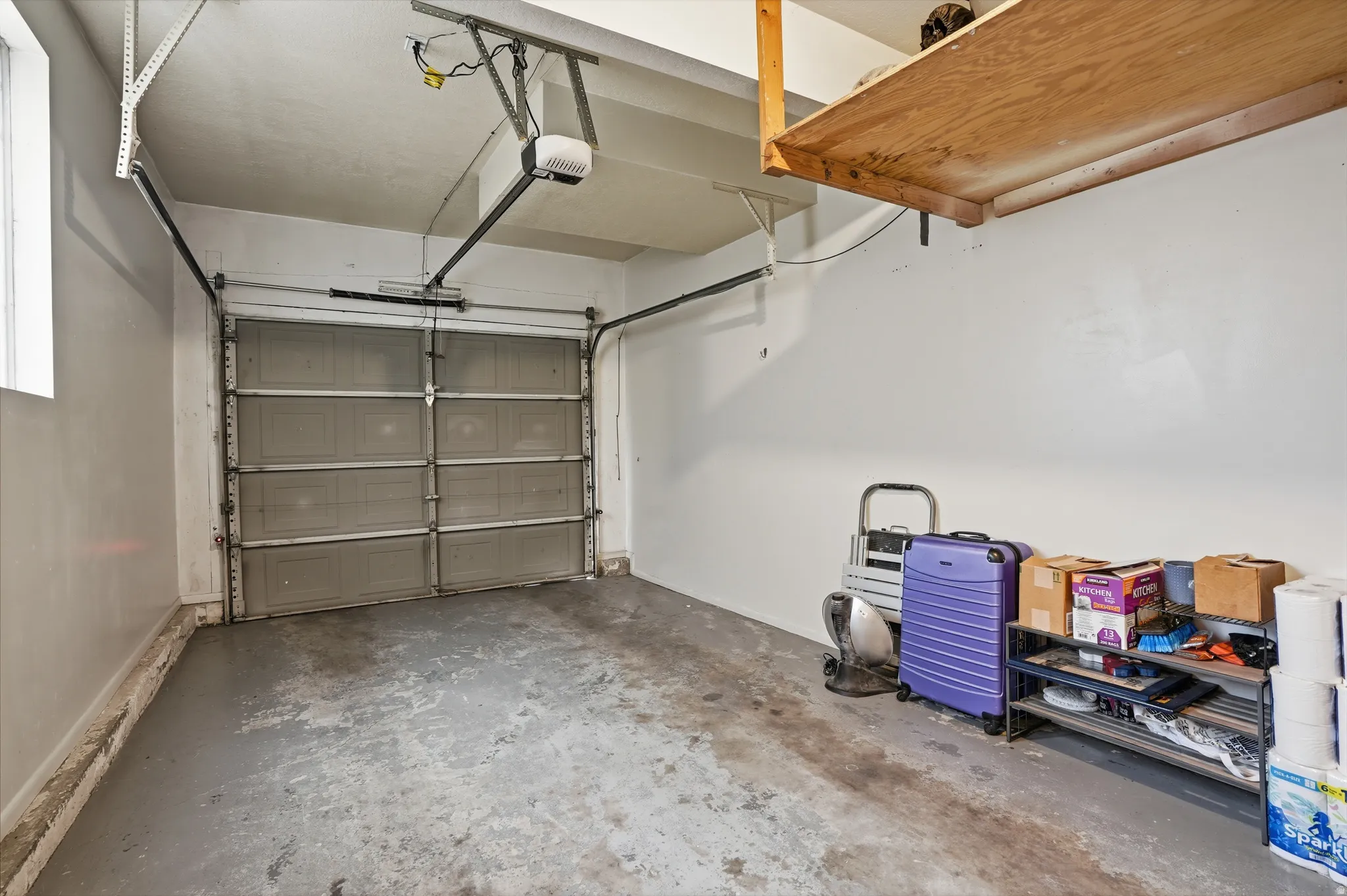 Garage featuring a garage door opener