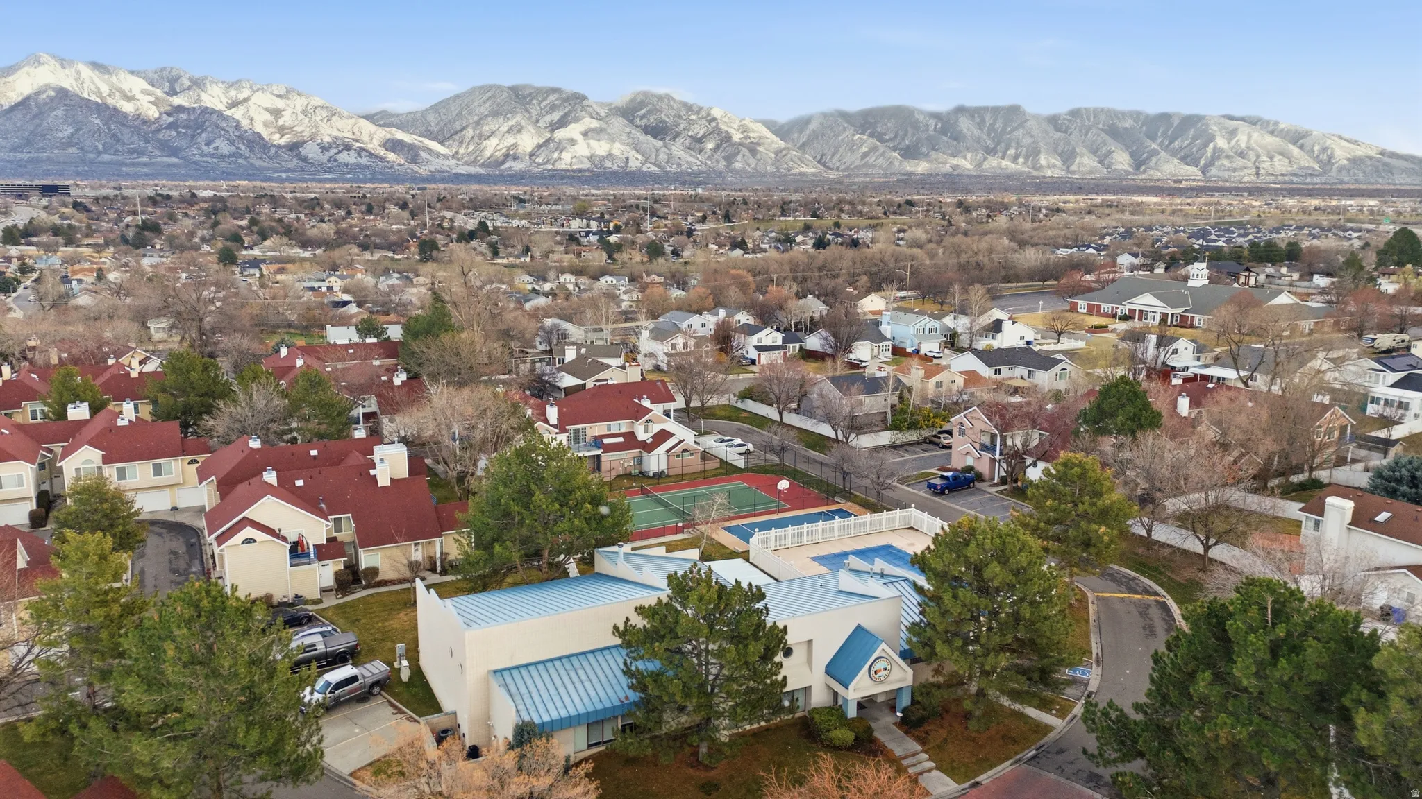 Aerial view of residential area with a mountain backdrop