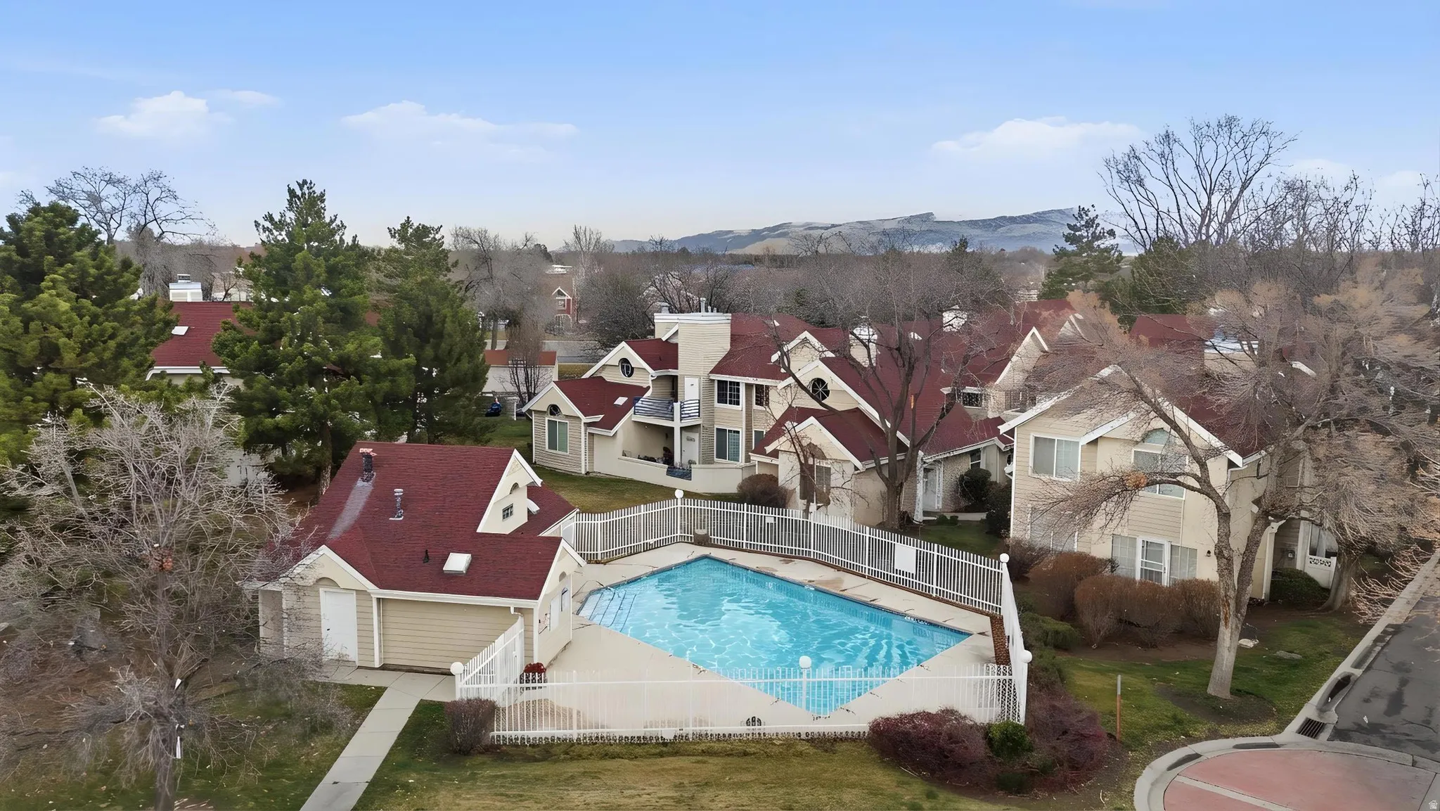 Community pool featuring a patio and a mountain view