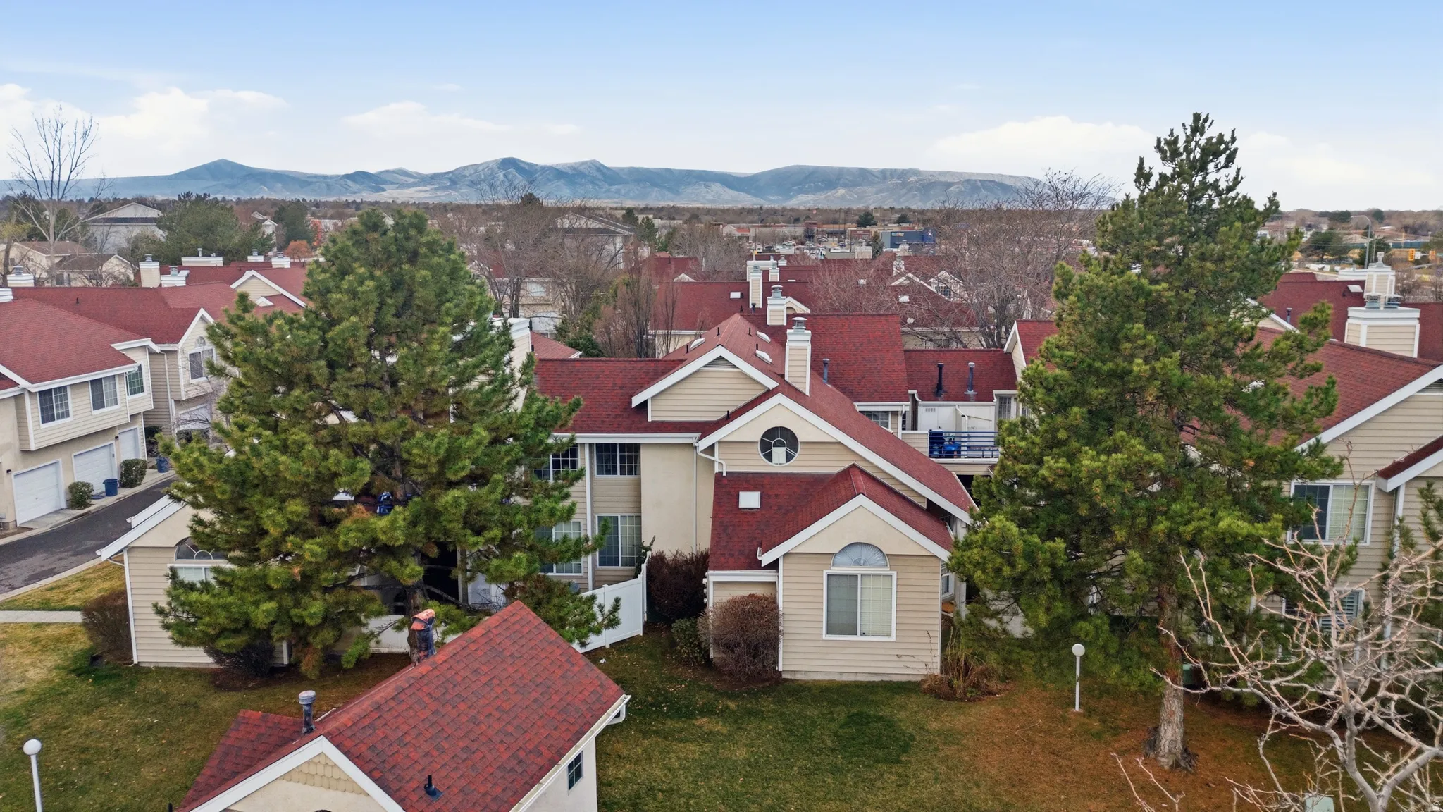 Aerial view of residential area with a mountainous background