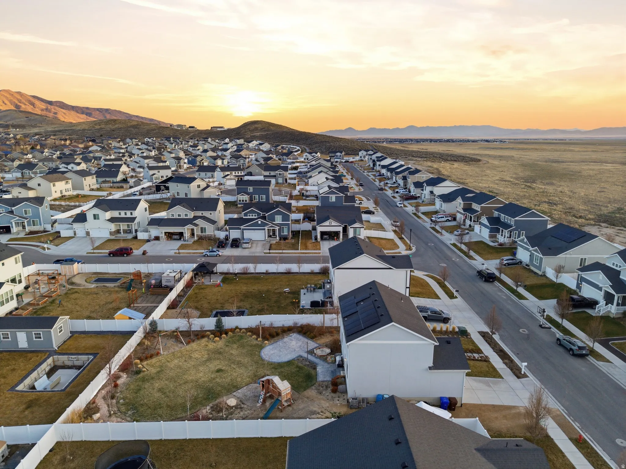 Aerial view at dusk of a residential view and a mountain view