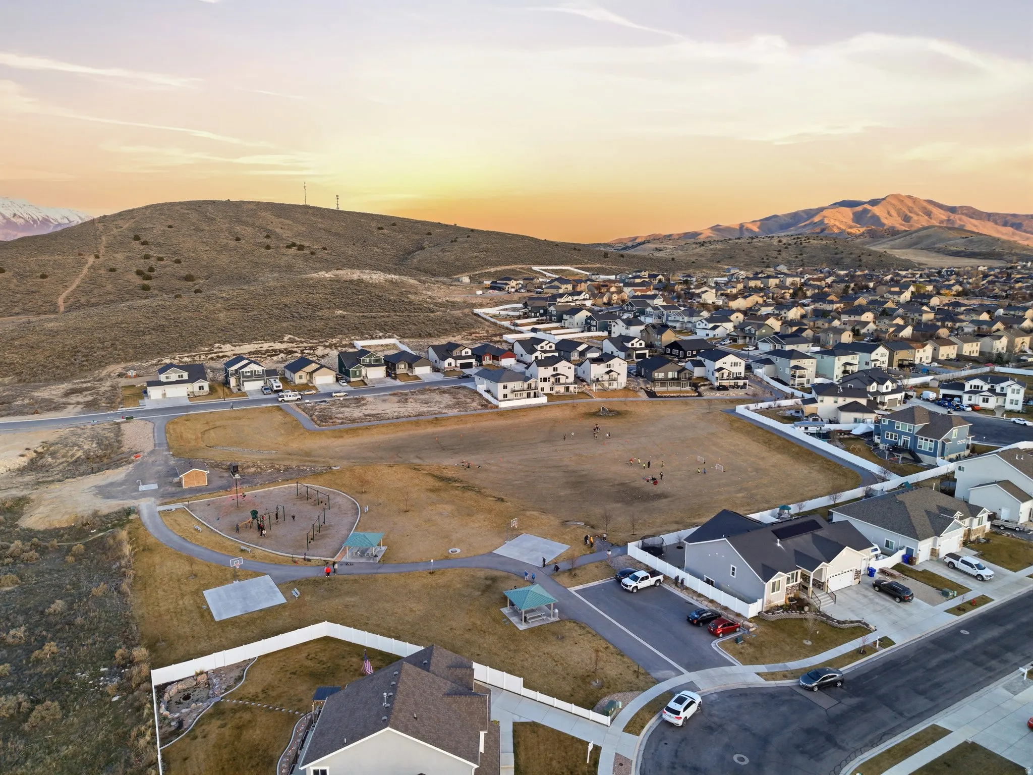 Aerial view at dusk of a residential view and a mountain view