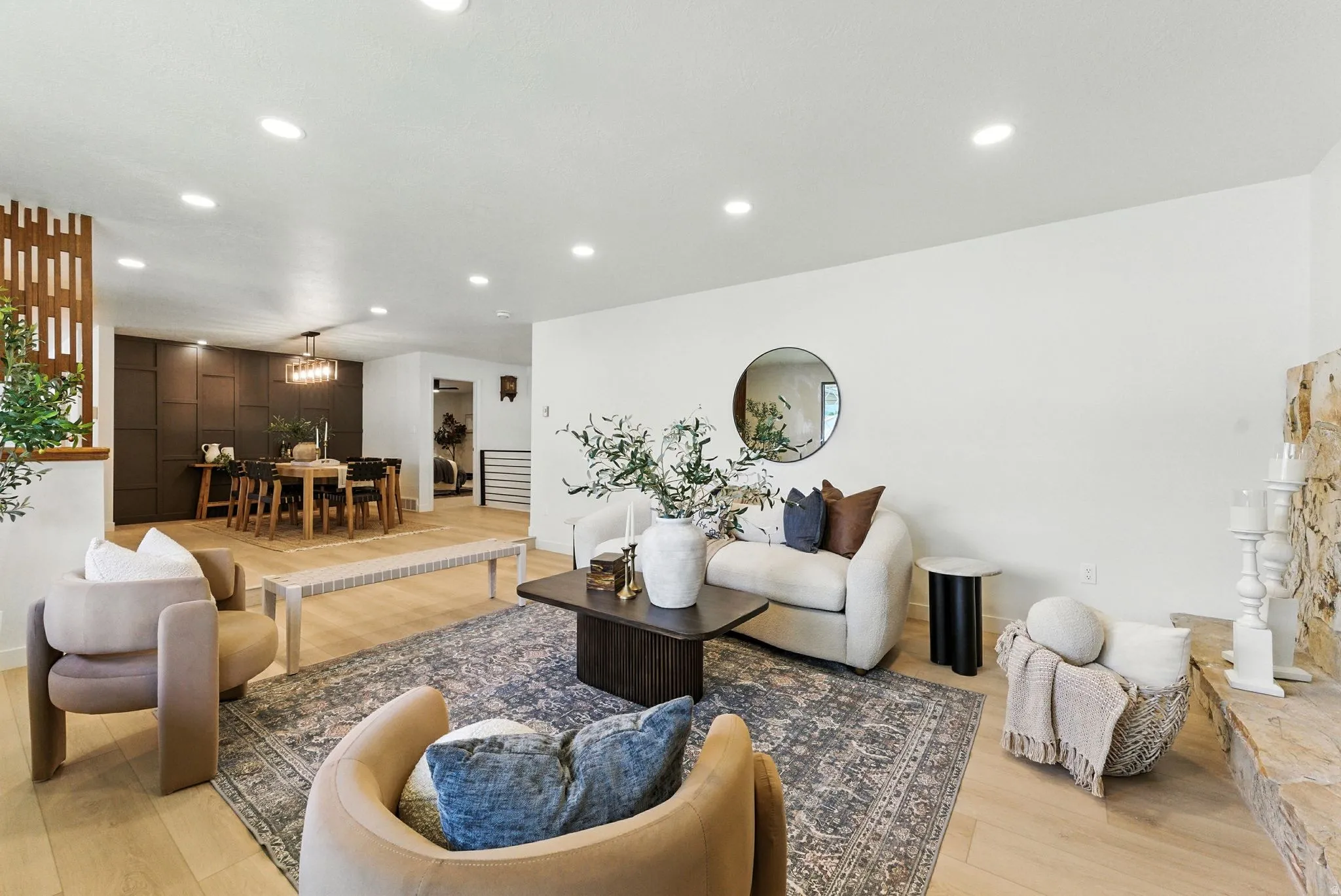 Living room with recessed lighting and light wood-type flooring